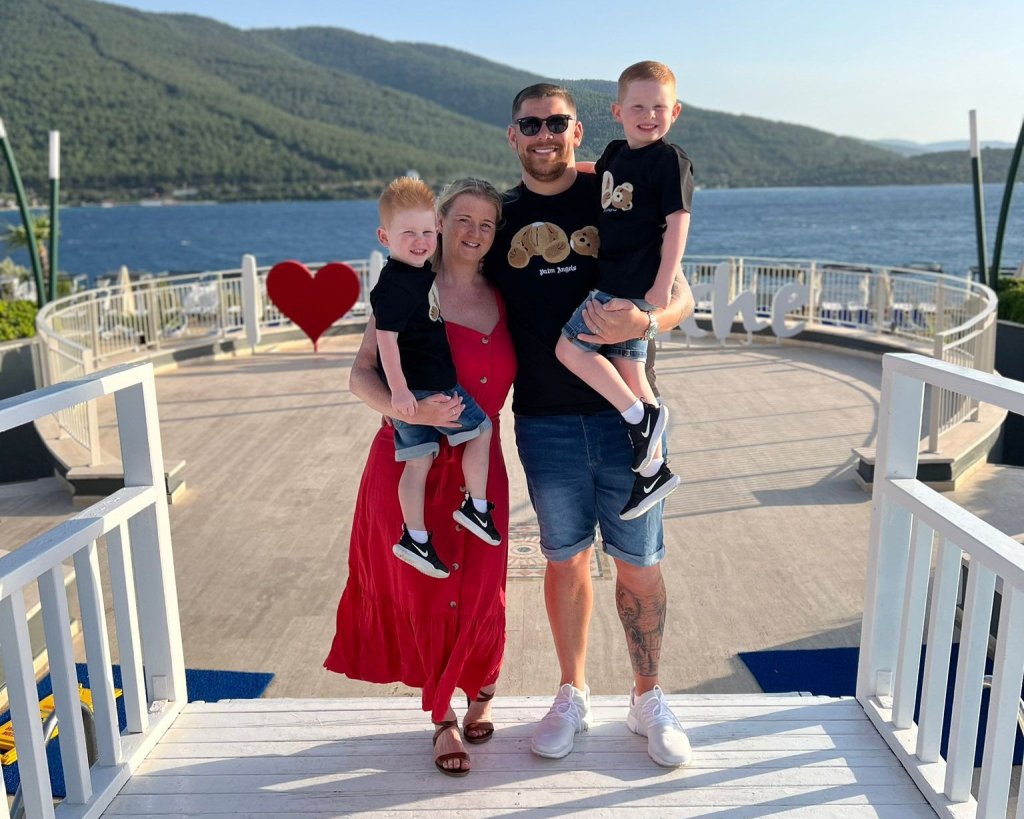 Andrew Walker with wife Becki and their two sons.